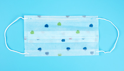 Medical mask for protection COVID-19 coronavirus, Medical respiratory bandage face on blue...