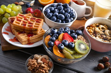 Concept of  healthy diet. Breakfast with fruits, berries, granola.