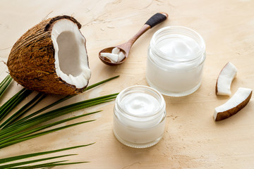 Homemade coconut cream - still life with spoon - on beige background