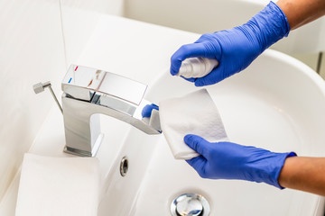 Coronavirus prevention, hygiene to stop spreading coronavirus. Decontamination and tap surface.