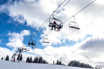 Fototapeta na wymiar View of the chairlifts of the Morzine ski slopes in the French Alps during winter
