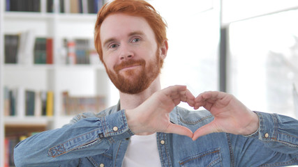 Heart Sign by Young Casual Redhead Man