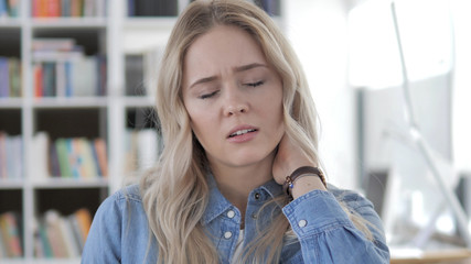 Fototapeta premium Tired Young Blonde Woman with Neck Pain