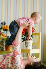 Happy loving family. Mother and her child baby girl playing in the summer day.