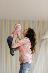 Happy loving family. Mother and her child baby girl playing in the summer day.