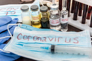 2019 new  danger disease coronavirus (2019-nCoV). Fasical mask with blood test tube. Find virus vaccine