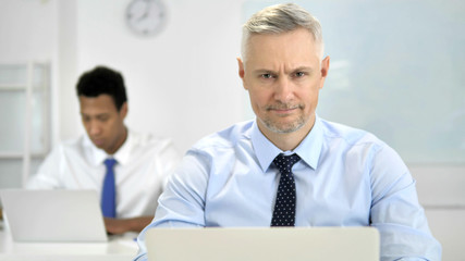 No, Grey Hair Businessman Shaking Head to Reject Plan
