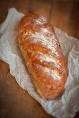 Freshly baked appetizing bread on the board