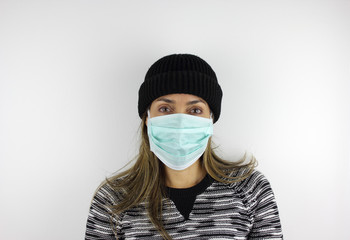 Latin American woman wearing a virus mask for the prevention of the corona virus