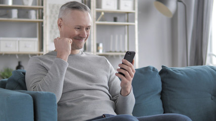 Gray Hair Man in Shock while Using Smartphone, Tragedy