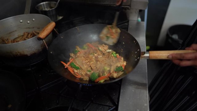 chef making thai food stir fry call pad see ew