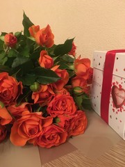 bouquet of red roses and gift box