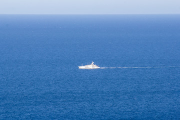 alone yacht on the blue sea