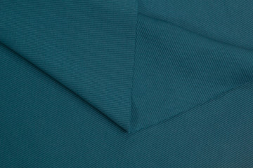 Fabric cotton fold, top view. Blue textile 