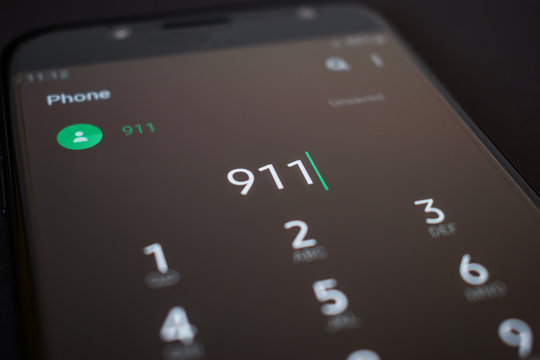 Emergency 911 call on smartphone, mobile phone, close up