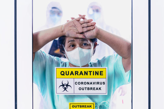 Coronavirus Covid 19 Infected Female Patient In A Quarantine Room With A Sign Of Quarantine Coronavirus Covid 19 Outbreak With Blurred Coronavirus Disease Control Experts Behind Background