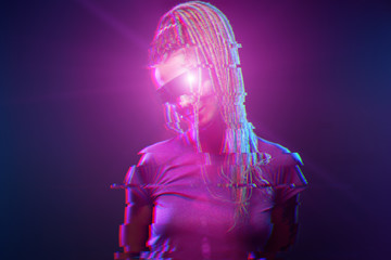 Young girl in sunglasses looking at camera in neon light. Image with glitch effect.