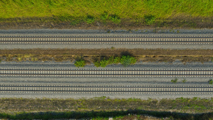 aerial view from flying drone of railroad tracks, train