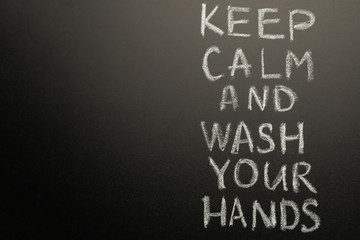 Chalk inscription on the blackboard - keep calm and wash your hands. Coronavirus and danger of getting sick. With space for inscription