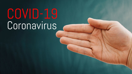 Coronavirus epidemic, word COVID-19 on the background with hand, COVID-19 outbreak and coronaviruses influenza background. Pandemic medical health risk, immunology, virology, epidemiology concept