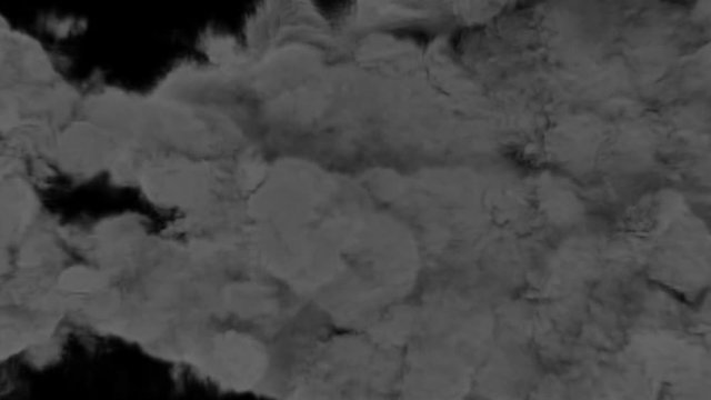 Animated burst of fire clusters or impulses with dense black smoke as if from failing jet engine or rocket buster wide nozzle. Black background, mask included.