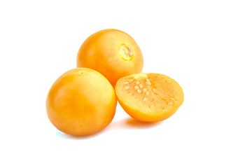 Goldenberries, Physalis peruviana ripe fruit, half and whole smooth berries isolated on a white background