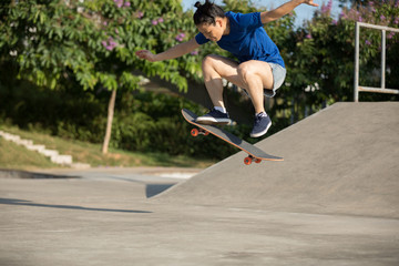 Woman skateboarder skating at skatepark © lzf