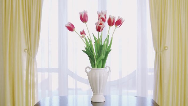 Beautiful bouquet of colorful tulips in vase. Happy Mothers Day. Spring time