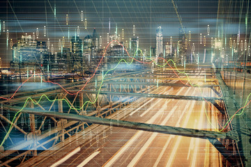Fototapeta premium Forex chart on cityscape with tall buildings background multi exposure. Financial research concept.