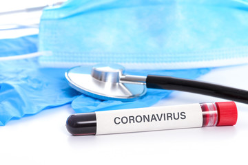 Virus COVID-19 pandemic concept - blood sample with  Coronavirus text on the desk in the laboratory.