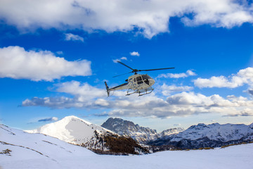 Fototapeta na wymiar Helicopter in the high mountains