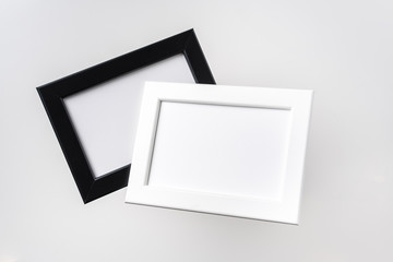 top view of two black and white photo frame on air