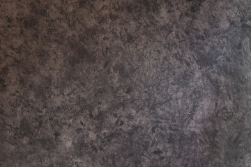 Texture of plaster painted in a heterogeneous gray color