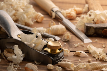 Chisel and small block plane with wood shavings