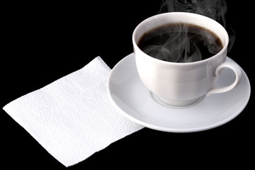 White clean napkin on a black background with a cup of coffee. The message is written on a napkin. For text design.