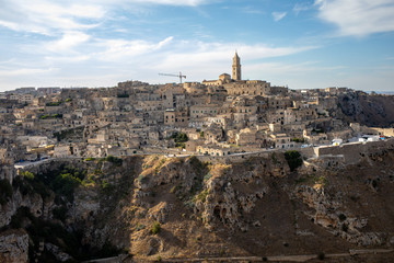 Panoramic view of Sassi di Matera a historic district in the city of Matera, well-known for their ancient cave dwellings from the Belvedere di Murgia Timone,  Basilicata, Italy