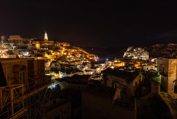 Naklejka premium Night landscape of the Sassi of Matera, well-known for their ancient cave dwellings. Basilicata. Italy