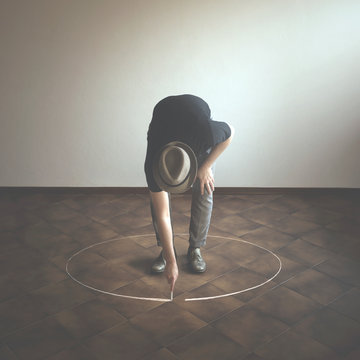 Man Drawing White Circle  Around Him With Chalk, Abstract Concept