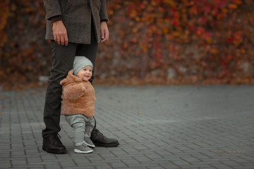 Baby Takes First Steps With Father's Help.