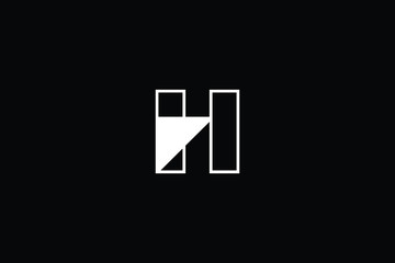 Minimal elegant monogram art logo. Outstanding professional trendy awesome artistic H initial based Alphabet icon logo. Premium Business logo White color on black background