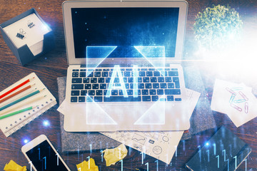 Double exposure of laptop computer and technology theme hologram. Concept of freelance work.