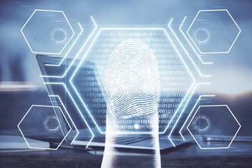 Computer on desktop in office with finger print drawing. Double exposure. Concept of business data security.