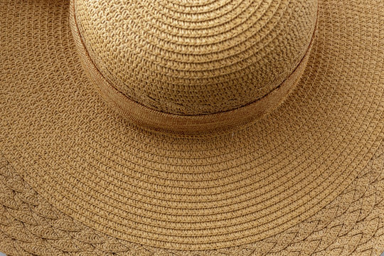 women's summer hat with wide brim, straw (golden) color, with a bow
