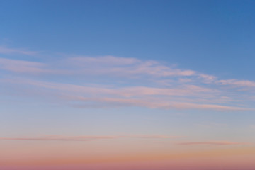Beautiful clear, morning sky at sunrise, natural background. Soft pink clouds.