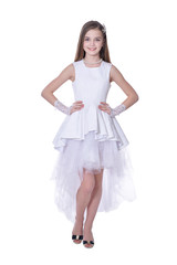 Naklejka premium Happy beautiful little girl in white dress posing isolated 