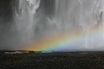 Beautiful high waterfall with a rainbow in Iceland