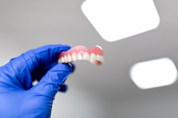 white-toothed denture and dentist material