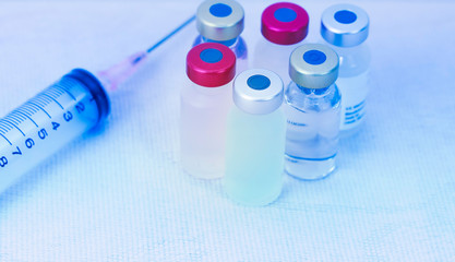 Biological hazard and Vaccine vial dose flu shot drug needle syringe