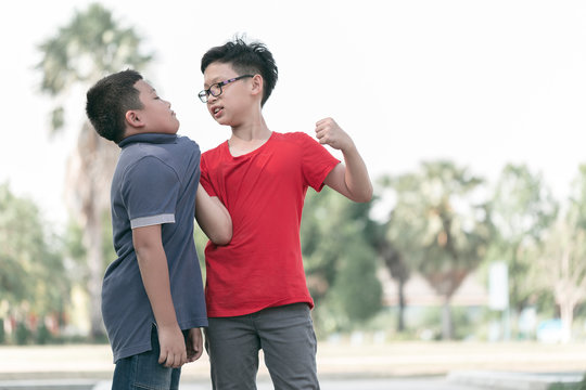 Asian Boy student getting bullied in school. Children bullying their classmate in playground.Violence, Banner and problem of bullying concept