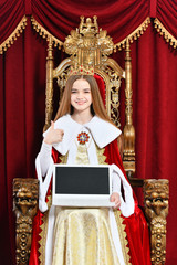 Fototapeta premium Portrait of beautiful teen girl holding laptop